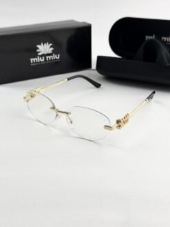 MIU MIU gold frame 1025